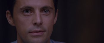 Movie still from “Stoker” (2013), directed by Park Chan-wook – A man's face in a dark room; Close Up shot, Over the shoulder angle