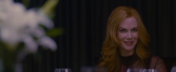 Movie still from “Stoker” (2013), directed by Park Chan-wook – A woman sitting at a table with a glass of wine in front of her; Close Up shot, Over the shoulder angle