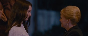 Movie still from “Stoker” (2013), directed by Park Chan-wook – Two young people talking to each other in the dark; Close Up shot, Over the shoulder angle