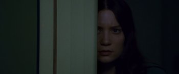 Movie still from “Stoker” (2013), directed by Park Chan-wook – A person behind a wall; Close Up shot, Low angle