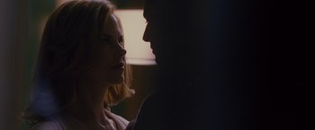 Movie still from “Stoker” (2013), directed by Park Chan-wook – A man and a woman face to face in the dark; Close Up shot, Over the shoulder angle