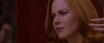 Movie still from “Stoker” (2013), directed by Park Chan-wook – A woman's face in a dark room; Close Up shot, Over the shoulder angle