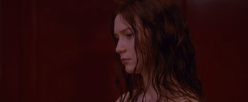 Movie still from “Stoker” (2013), directed by Park Chan-wook – A woman with long brown hair is looking to her left; Close Up shot, Low angle