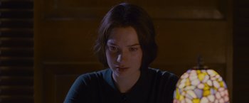 Movie still from “Stoker” (2013), directed by Park Chan-wook – A young woman sitting in front of a computer monitor; Close Up shot, Over the shoulder angle