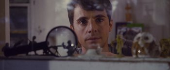 Movie still from “Stoker” (2013), directed by Park Chan-wook – A man looking at himself in a mirror; Close Up shot, Over the shoulder angle