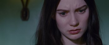 Movie still from “Stoker” (2013), directed by Park Chan-wook – A person with long hair; Close Up shot, High angle