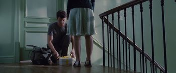 Movie still from “Stoker” (2013), directed by Park Chan-wook – A man and a woman standing next to each other on the stairs; Medium shot, High angle