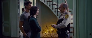 Movie still from “Stoker” (2013), directed by Park Chan-wook – A man and a woman talking to each other in front of candles; Medium shot, Over the shoulder angle