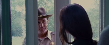 Movie still from “Stoker” (2013), directed by Park Chan-wook – A man and a woman looking at each other in a mirror; Close Up shot, Over the shoulder angle