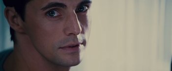 Movie still from “Stoker” (2013), directed by Park Chan-wook – A man's face with a white background; Close Up shot, Over the shoulder angle