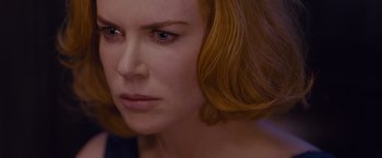 Movie still from “Stoker” (2013), directed by Park Chan-wook – A person with short red hair; Close Up shot, Over the shoulder angle