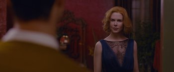 Movie still from “Stoker” (2013), directed by Park Chan-wook – A woman in a blue dress is looking at the camera; Close Up shot, Over the shoulder angle