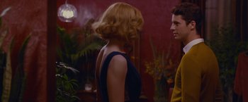 Movie still from “Stoker” (2013), directed by Park Chan-wook – A woman in a blue dress is talking to a man in a yellow shirt; Medium shot, Over the shoulder angle