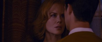 Movie still from “Stoker” (2013), directed by Park Chan-wook – A woman's face as a man looks on; Close Up shot, Over the shoulder angle