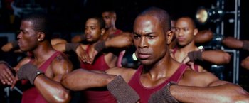 A group of men are doing different exercises together