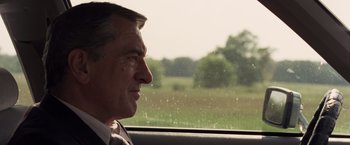 Movie still from “Stone” (2010), directed by John Curran – A person looking out of a car window; Close Up shot, Over the shoulder angle