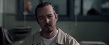 Movie still from “Stone” (2010), directed by John Curran – A person with a beard; Close Up shot, Over the shoulder angle