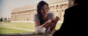 Movie still from “Stone” (2010), directed by John Curran – A woman sitting at a table with a bowl of eggs; Close Up shot, Over the shoulder angle
