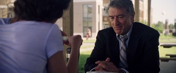 Movie still from “Stone” (2010), directed by John Curran – An older man and a young woman are having a conversation; Close Up shot, Over the shoulder angle
