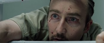 Movie still from “Stone” (2010), directed by John Curran – A person with blood all over his face; Extreme Close Up shot, Overhead angle
