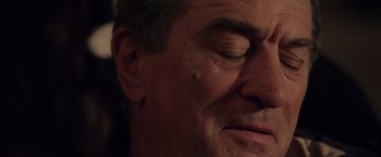 Movie still from “Stone” (2010), directed by John Curran – A man's face with his eyes closed; Extreme Close Up shot, High angle