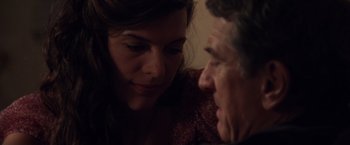 Movie still from “Stone” (2010), directed by John Curran – An older man and a younger woman looking at each other; Close Up shot, Over the shoulder angle