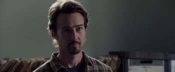 Movie still from “Stone” (2010), directed by John Curran – A person wearing a plaid shirt; Close Up shot, Over the shoulder angle