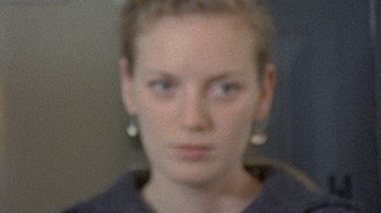 Movie still from “Stories We Tell” (2012), directed by Sarah Polley – A blurry picture of a woman's face; Close Up shot, High angle