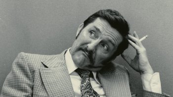 Movie still from “Stories We Tell” (2012), directed by Sarah Polley – An older man in a suit and tie with his hand on his head; Close Up shot, Low angle