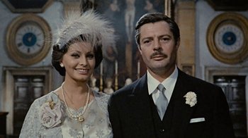 Movie still from “Stories We Tell” (2012), directed by Sarah Polley – A man and a woman standing next to each other; Close Up shot, Low angle