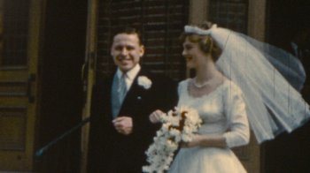 Movie still from “Stories We Tell” (2012), directed by Sarah Polley – An old photo of a man and woman on their wedding day; Close Up shot, High angle