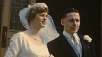 Movie still from “Stories We Tell” (2012), directed by Sarah Polley – An old photo of a man and a woman in their wedding attire; Close Up shot, Low angle