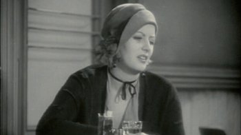 Movie still from “Stories We Tell” (2012), directed by Sarah Polley – An old black and white photo of a woman in a hat; Close Up shot, High angle