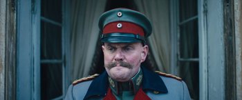 Movie still from “All Quiet on the Western Front” (2022), directed by Edward Berger – A person wearing a military uniform; Close Up shot, Low angle