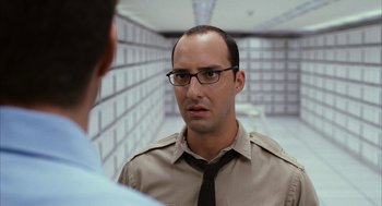 Movie still from “Stranger Than Fiction” (2006), directed by Marc Forster – A man wearing glasses and a shirt and tie; Close Up shot, Over the shoulder angle