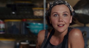 Movie still from “Stranger Than Fiction” (2006), directed by Marc Forster – A woman in a kitchen wearing an apron; Close Up shot, Over the shoulder angle