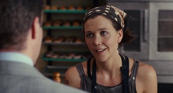 Movie still from “Stranger Than Fiction” (2006), directed by Marc Forster – A woman wearing a head scarf talking to a man in a bakery; Close Up shot, Over the shoulder angle
