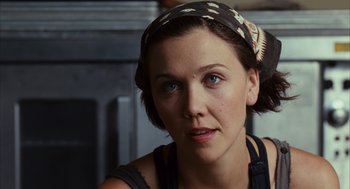 Movie still from “Stranger Than Fiction” (2006), directed by Marc Forster – A person wearing a headband; Close Up shot, Over the shoulder angle