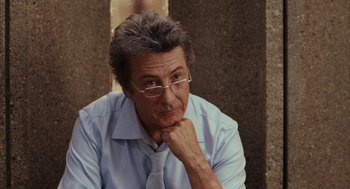 Movie still from “Stranger Than Fiction” (2006), directed by Marc Forster – An older man wearing a blue shirt and a tie; Close Up shot, Over the shoulder angle