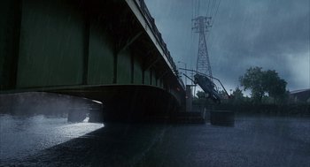 Movie still from “Stranger Than Fiction” (2006), directed by Marc Forster – A bridge that has been opened up in the rain; Extreme Wide shot, High angle