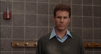 Movie still from “Stranger Than Fiction” (2006), directed by Marc Forster – A man in a black sweater and a blue shirt; Close Up shot, Over the shoulder angle