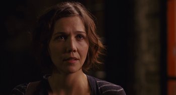 Movie still from “Stranger Than Fiction” (2006), directed by Marc Forster – A person with short brown hair; Close Up shot, Over the shoulder angle