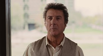 Movie still from “Stranger Than Fiction” (2006), directed by Marc Forster – An older man wearing a white shirt and a vest; Close Up shot, Over the shoulder angle