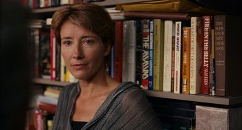 Movie still from “Stranger Than Fiction” (2006), directed by Marc Forster – A woman standing in front of a book shelf; Close Up shot, Over the shoulder angle