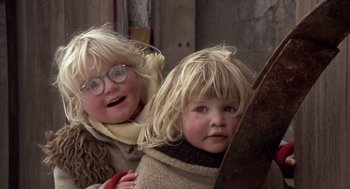 Movie still from “Straw Dogs” (1971), directed by Sam Peckinpah – Two little girls with blonde hair and wearing glasses; Close Up shot, High angle