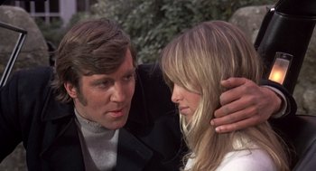 Movie still from “Straw Dogs” (1971), directed by Sam Peckinpah – A man and a woman looking at one another; Close Up shot, Low angle