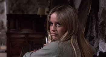 Movie still from “Straw Dogs” (1971), directed by Sam Peckinpah – A beautiful young woman with long blonde hair; Close Up shot, Over the shoulder angle