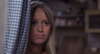 Movie still from “Straw Dogs” (1971), directed by Sam Peckinpah – A beautiful young lady with long blonde hair; Close Up shot, Over the shoulder angle