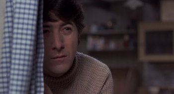 Movie still from “Straw Dogs” (1971), directed by Sam Peckinpah – A person wearing a sweater; Close Up shot, Low angle
