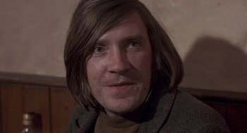 Movie still from “Straw Dogs” (1971), directed by Sam Peckinpah – A person with long hair; Close Up shot, Low angle